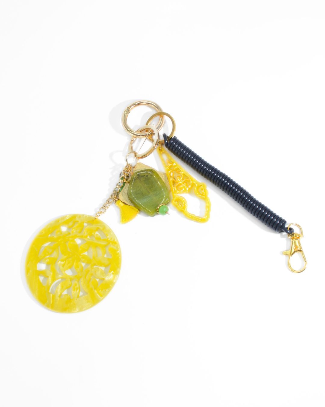 Charm da borsa Sole giallo con pietra verde e cordino nero